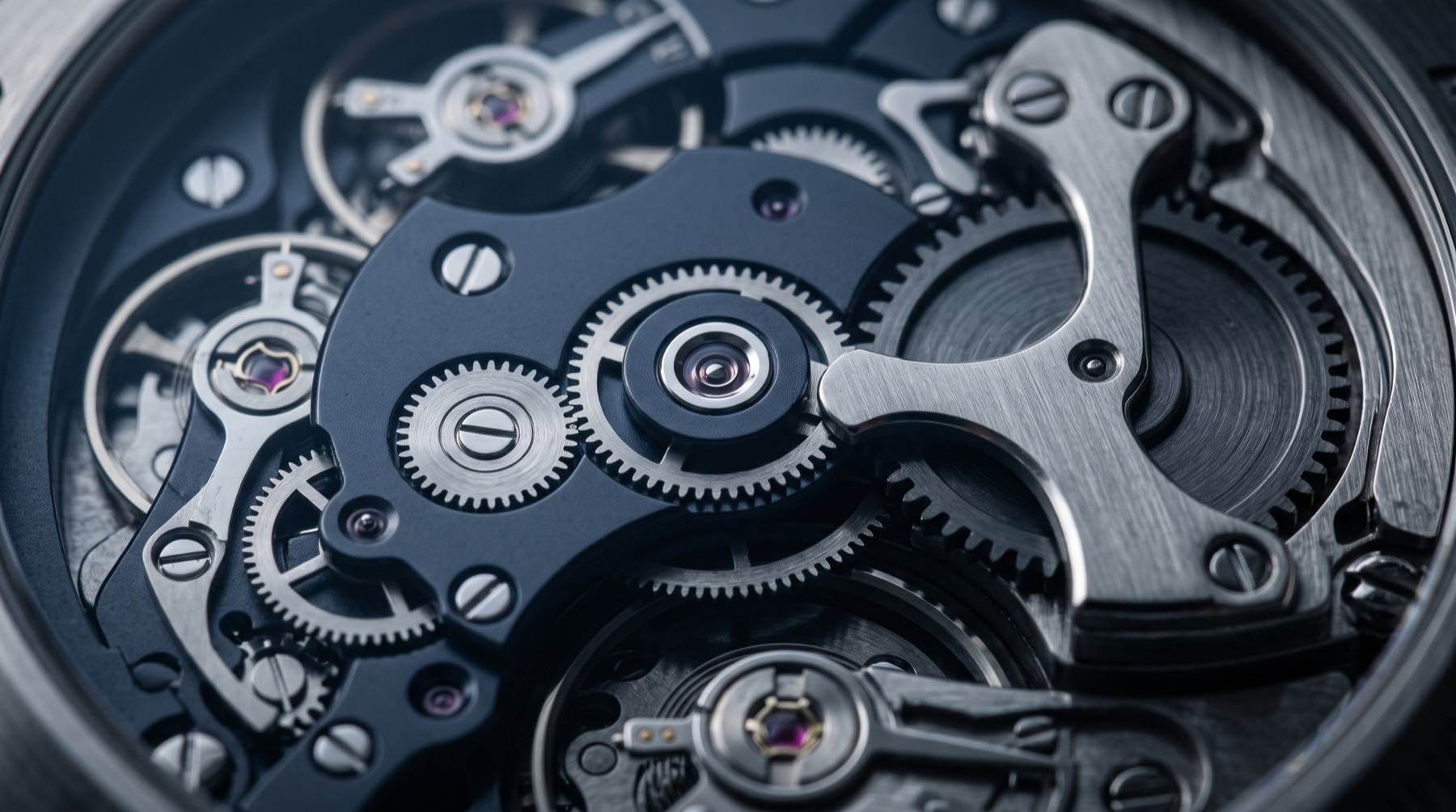 Close-up of a precision mechanical movement in brushed steel